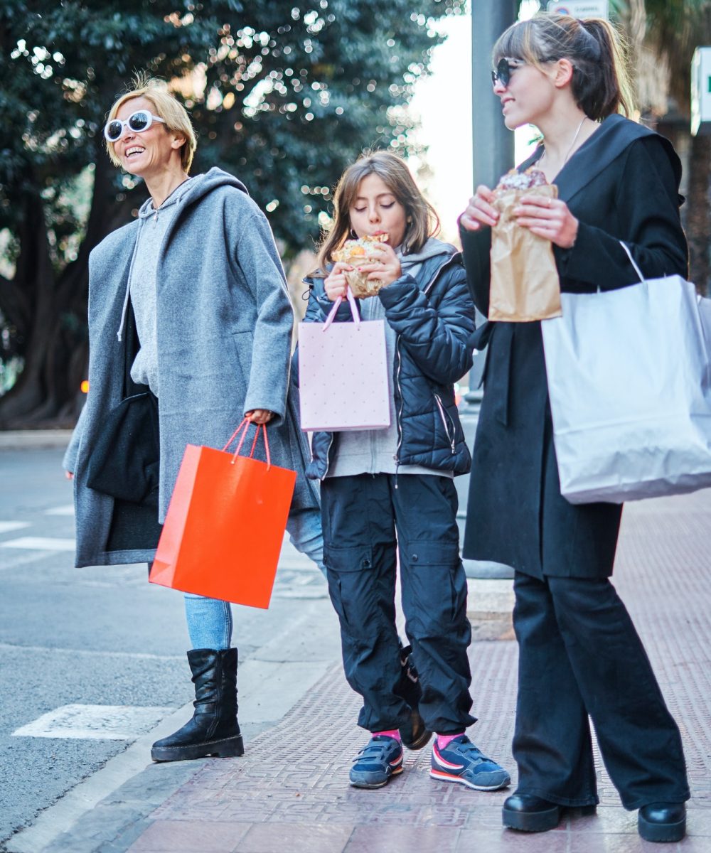 happy-women-with-purchases-waiting-for-a-taxi-in-the-derby